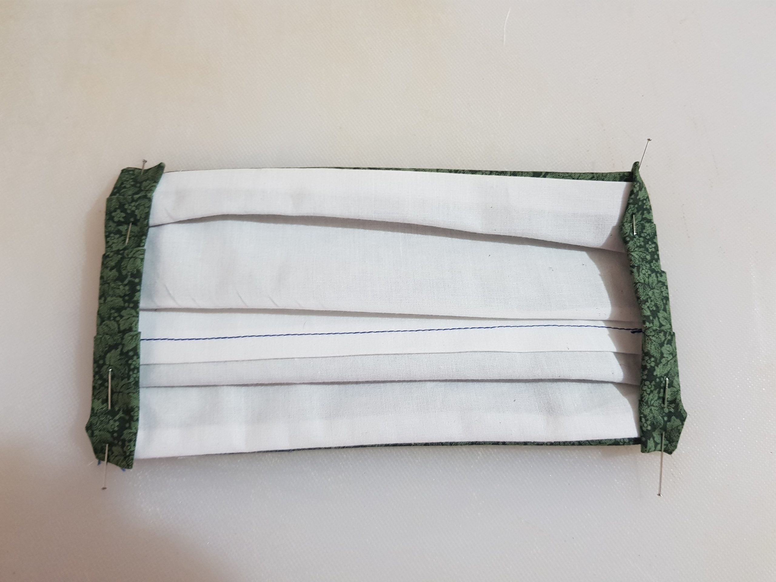 face mask pinned and ready