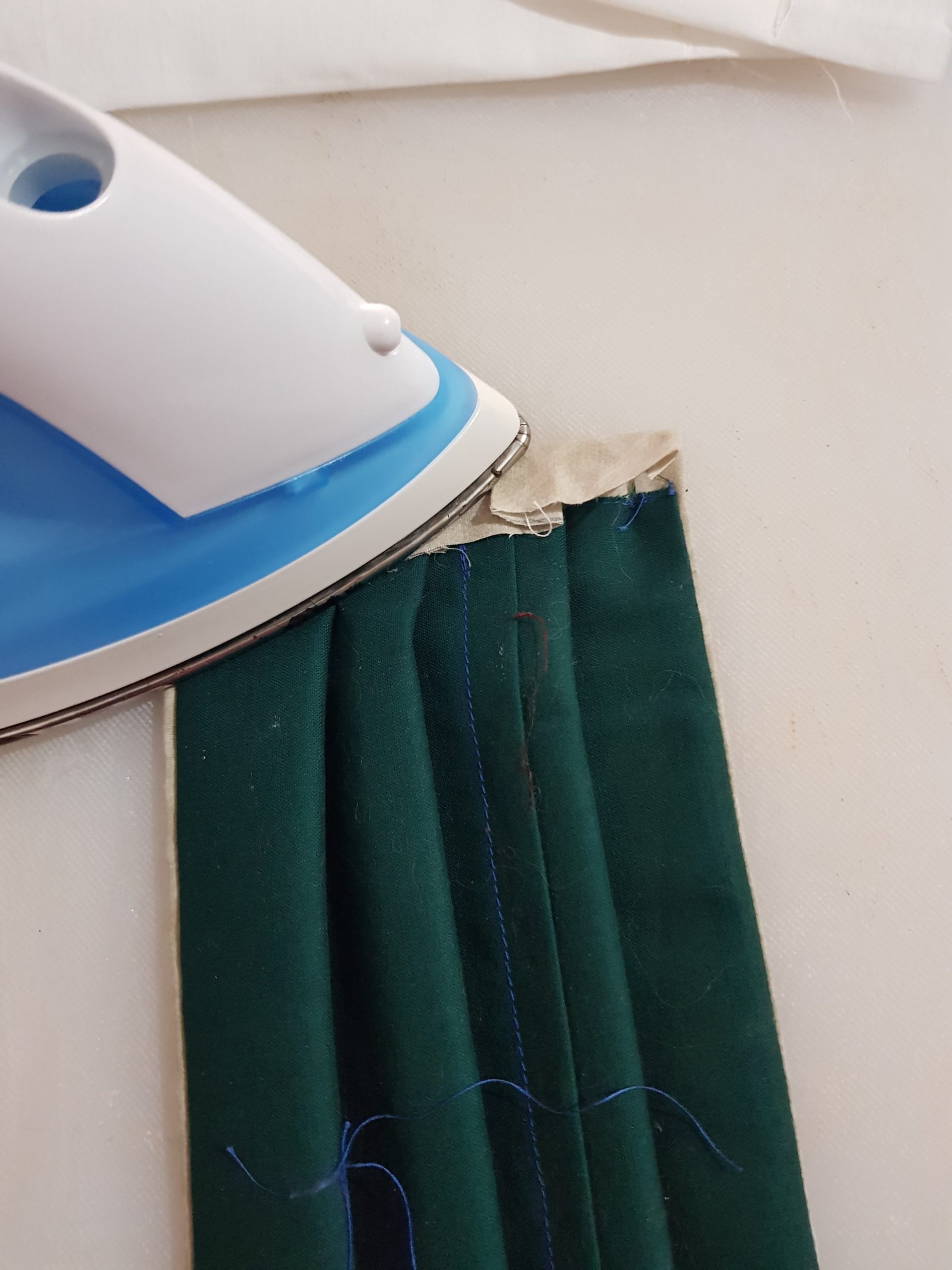 Iron edges of mask before sewing